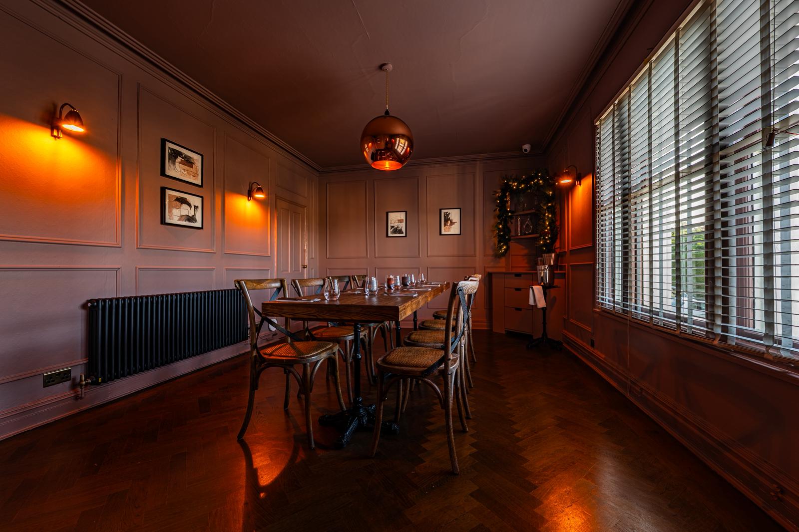 Private function room set up for a celebration dinner
